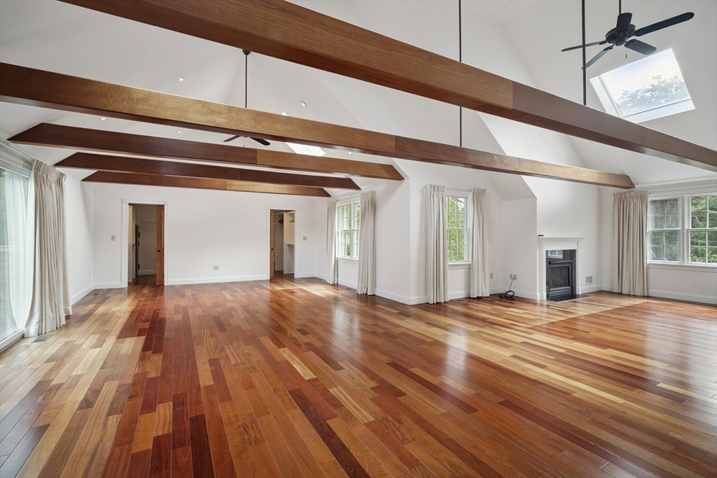 107 Wareham Street Carver, MA 02330 - Photo 13 of 25 a view of an empty room with wooden floor and kitchen view