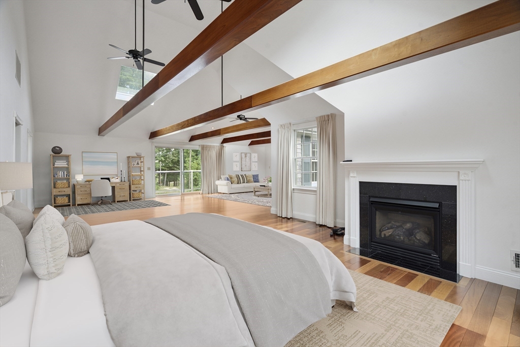 107 Wareham Street Carver, MA 02330 - Photo 14 of 25 a bedroom with a bed and a fireplace