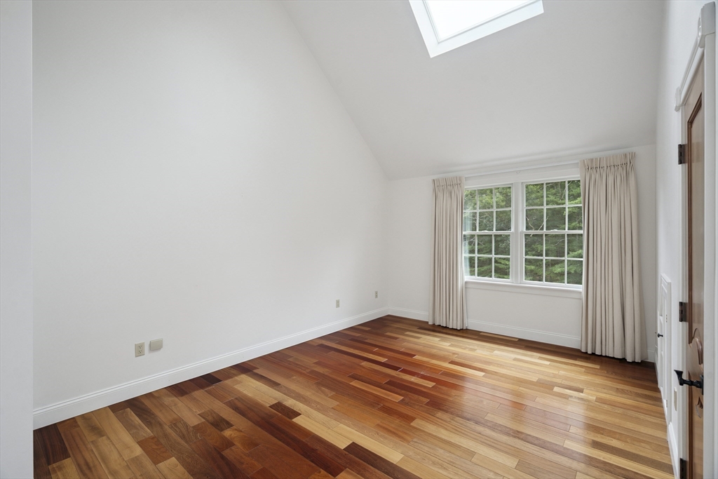 107 Wareham Street Carver, MA 02330 - Photo 19 of 25 a view of empty room with wooden floor and fan