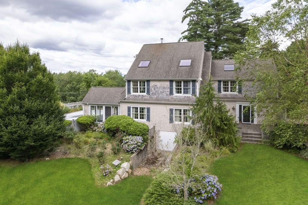 107 Wareham Street Carver, MA 02330 - Photo 2 of 25 a front view of a house with garden