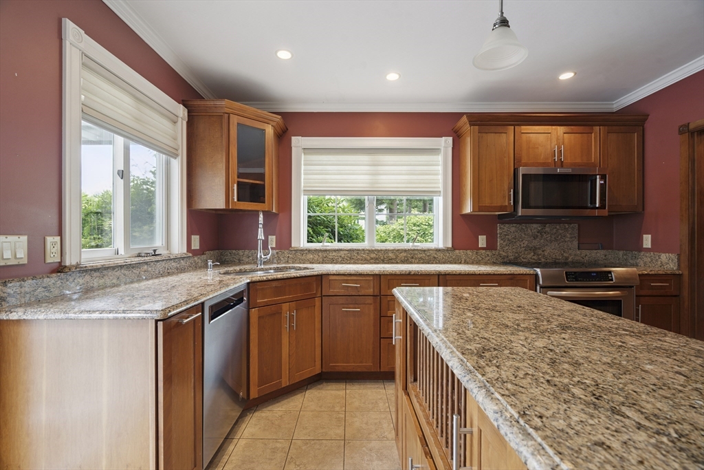 107 Wareham Street Carver, MA 02330 - Photo 3 of 25 a kitchen with stainless steel appliances granite countertop sink stove microwave and refrigerator