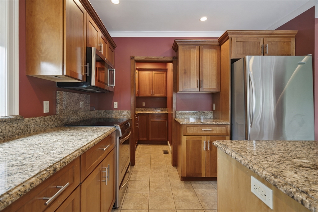 107 Wareham Street Carver, MA 02330 - Photo 4 of 25 a kitchen with stainless steel appliances granite countertop a sink stove and refrigerator