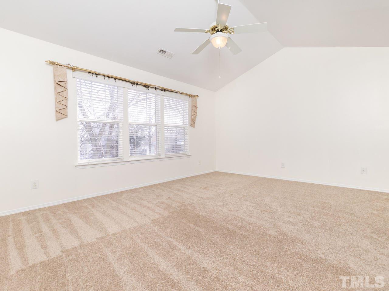 8301 Rubblestone Path Raleigh, NC 27613 - Photo 22 of 30 a view of an empty room with a window