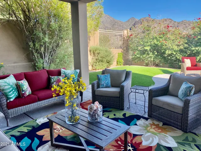 a kitchen with stainless steel appliances granite countertop a sink refrigerator and cabinets
