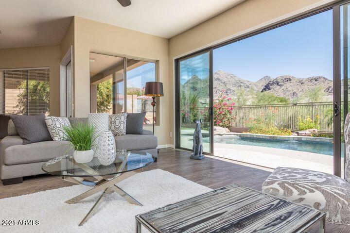 16715 North 108th Way Scottsdale, AZ 85255 - Photo 17 of 104 a living room with furniture and a floor to ceiling window