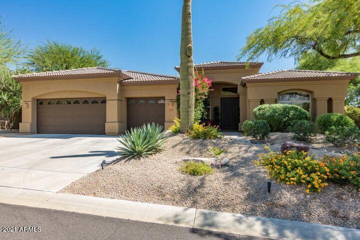 16715 North 108th Way Scottsdale, AZ 85255 - Photo 24 of 104 a front view of a house with a yard and garage