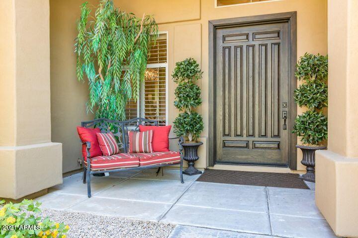 16715 North 108th Way Scottsdale, AZ 85255 - Photo 25 of 104 a backyard of a house with barbeque oven table and chairs