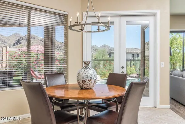 a patio with patio table and chairs