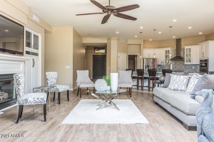 16715 North 108th Way Scottsdale, AZ 85255 - Photo 37 of 104 a living room with furniture and a fireplace