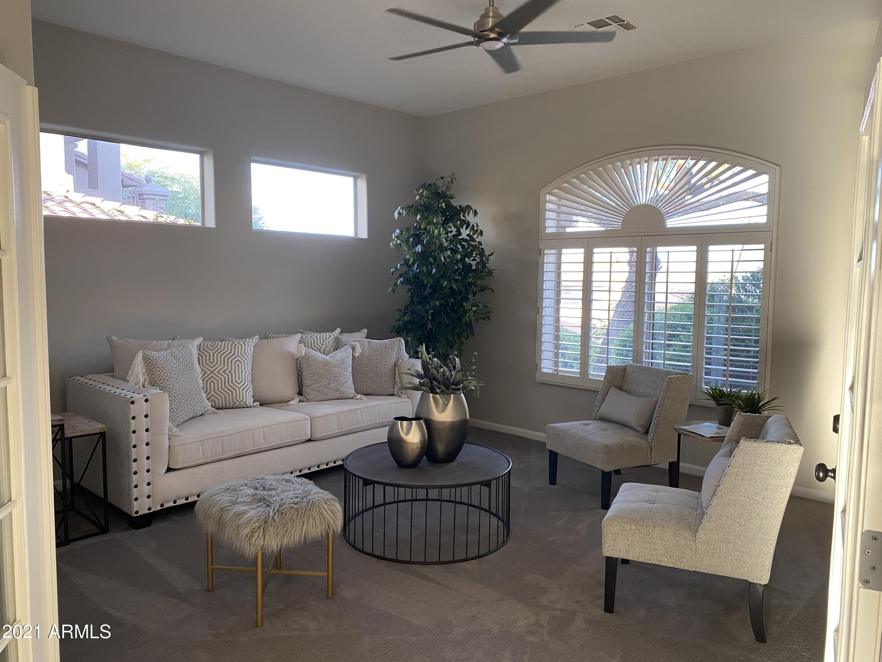 16715 North 108th Way Scottsdale, AZ 85255 - Photo 44 of 104 a living room with furniture and a large window