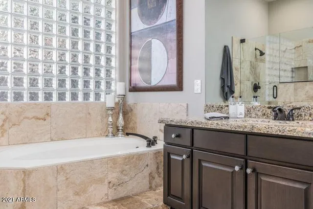 an aerial view of a house with a yard and lake view