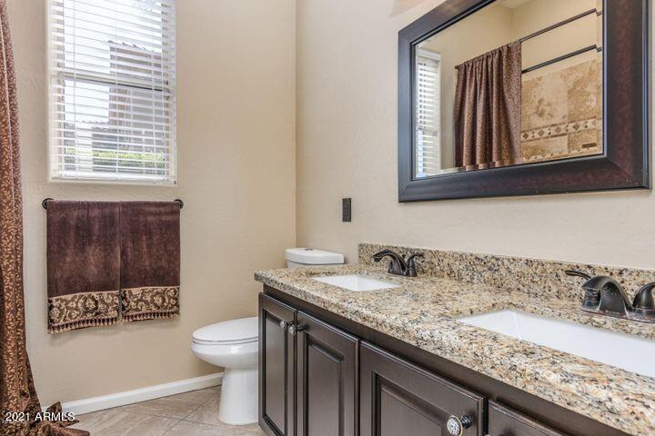 16715 North 108th Way Scottsdale, AZ 85255 - Photo 52 of 104 a bathroom with a granite countertop sink mirror vanity and toilet