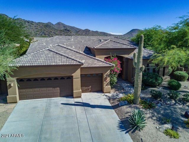 16715 North 108th Way Scottsdale, AZ 85255 - Photo 80 of 104 a front view of a house with a garden