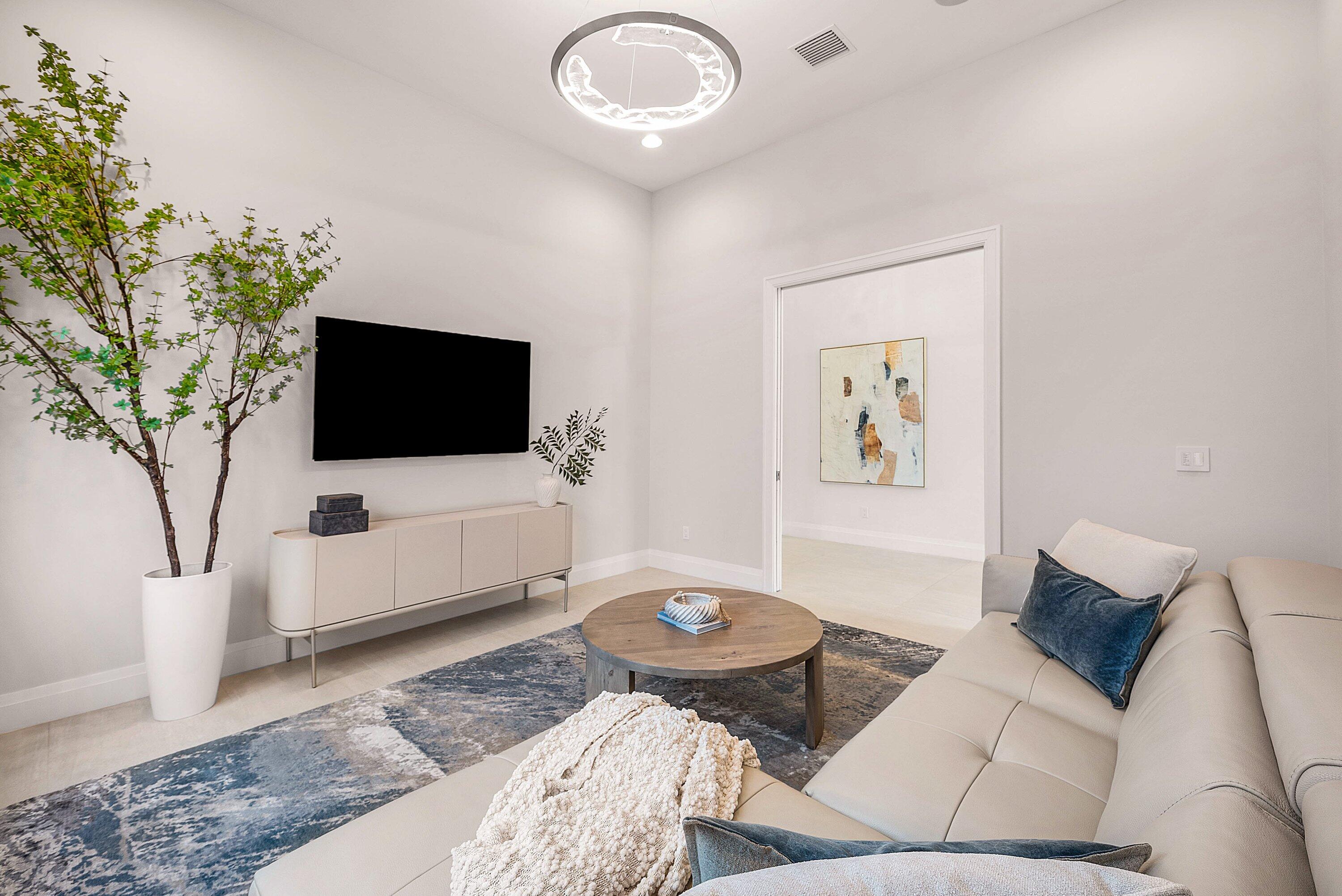 17135 Abruzzo Avenue Boca Raton, FL 33496 - Photo 12 of 95 a living room with furniture and a flat screen tv