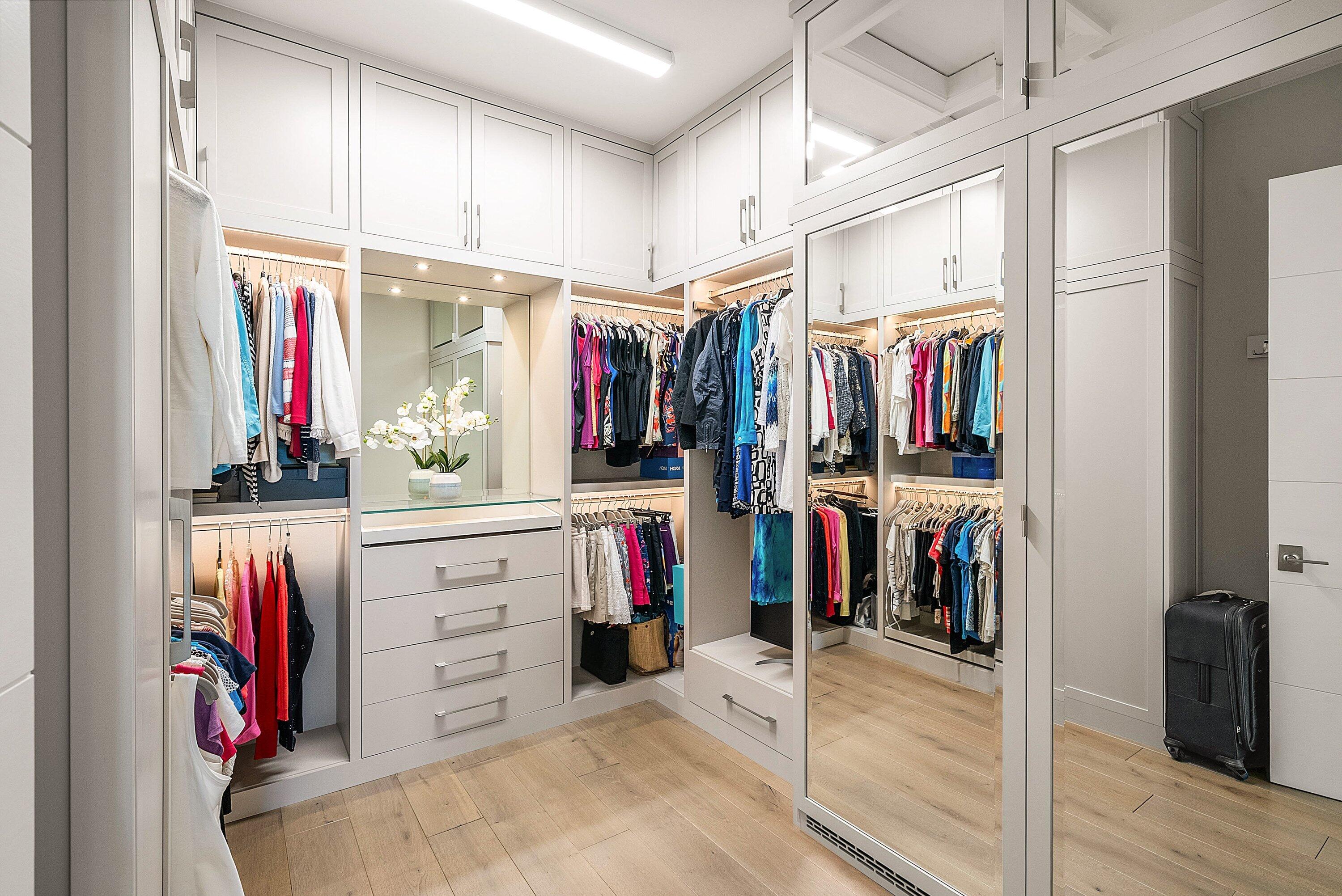 17135 Abruzzo Avenue Boca Raton, FL 33496 - Photo 41 of 95 a view of walk in closet with clothes