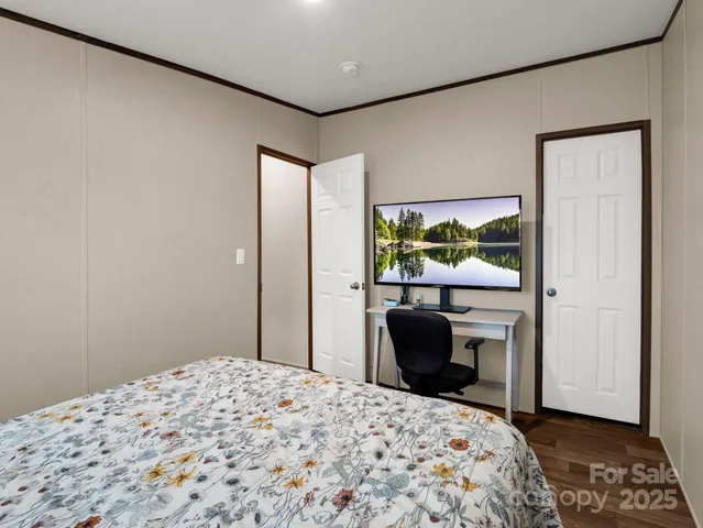 a bedroom with a bed and a couch