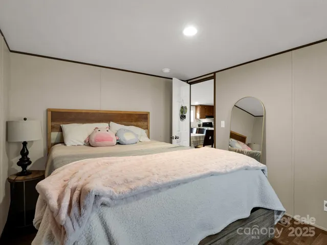 a bedroom with a bed and a walk in closet