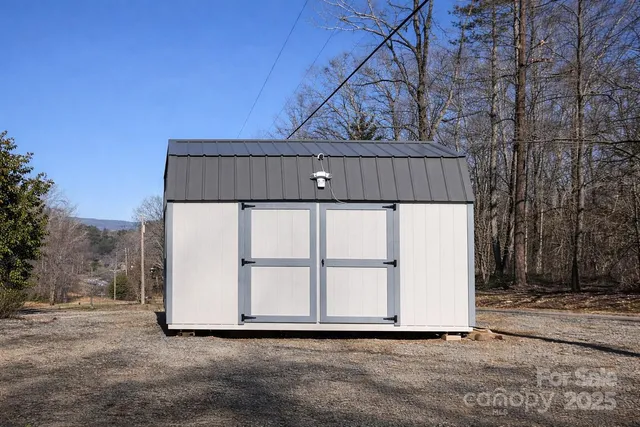 a view of a house with a yard covered with snow in front of house