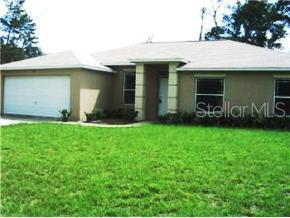 3104 Southwest 162nd Street Road Ocala, FL 34473 - Photo 1 of 1 a view of a house with a garden