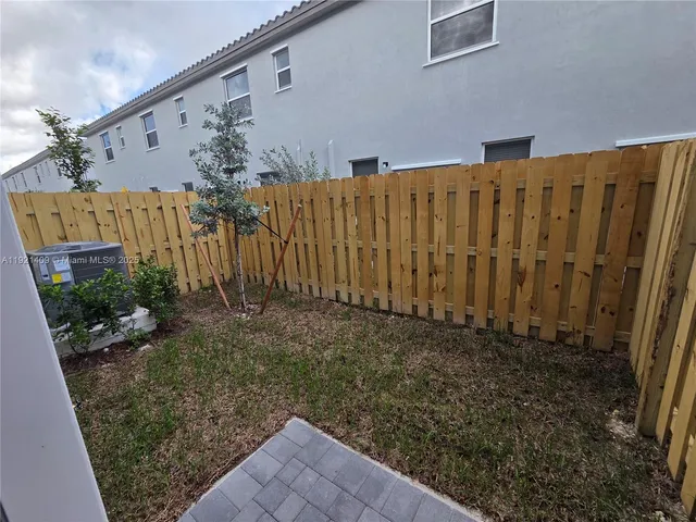 a view of a entryway with wooden floor