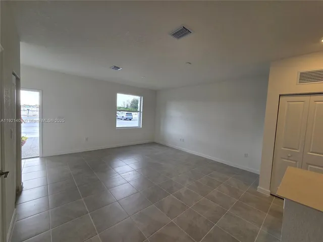 a view of an empty room and window
