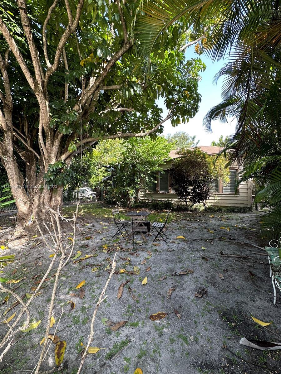 2430 Southwest 25th Terrace, Unit A Miami, FL 33133 - Photo 15 of 19 a view of outdoor space with deck and yard