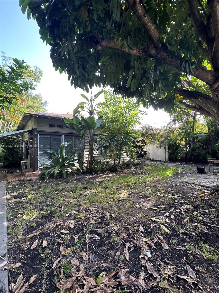 2430 Southwest 25th Terrace, Unit A Miami, FL 33133 - Photo 18 of 19 a view of a house with yard and tree s