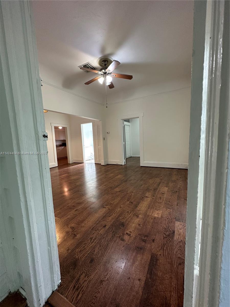 2430 Southwest 25th Terrace, Unit A Miami, FL 33133 - Photo 6 of 19 a view of empty room with wooden floor