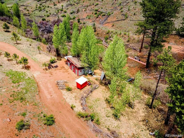 a view of a mountain with a snow in the background