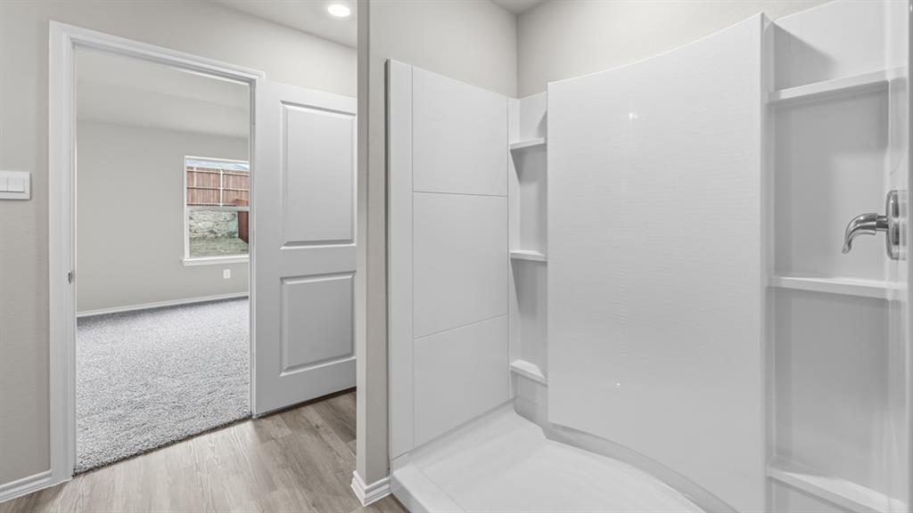 1920 Cherokee Lane Cleburne, TX 76033 - Photo 19 of 34 a bathroom with a shower and toilet