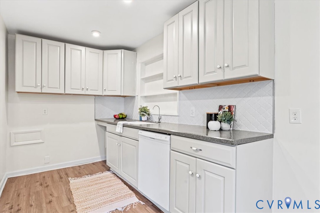 1509 Enon Church Road Chester, VA 23836 - Photo 11 of 32 a kitchen with stainless steel appliances granite countertop a sink and dishwasher with white cabinets