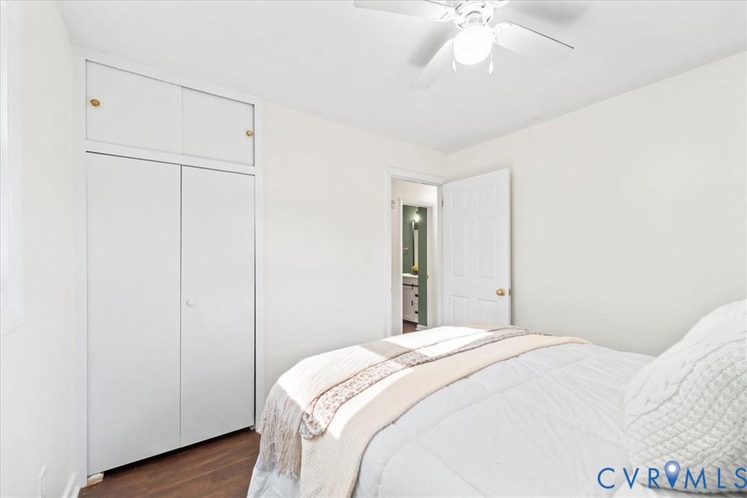 1509 Enon Church Road Chester, VA 23836 - Photo 24 of 32 a bedroom with a bed and a chandelier