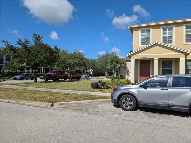 a view of a car parked in front of a house