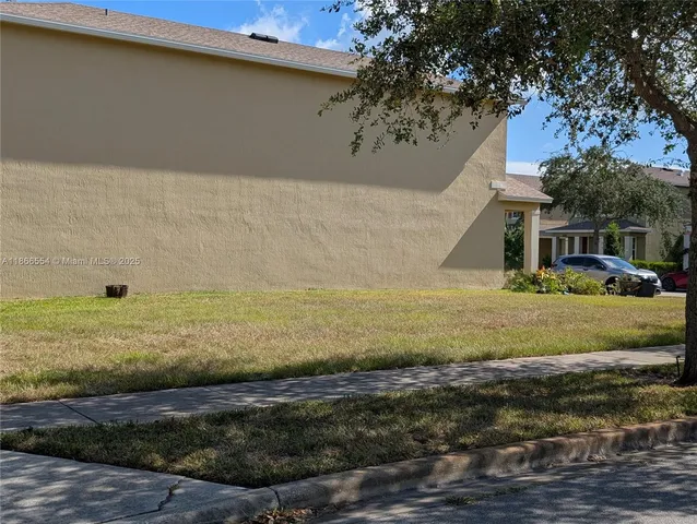 a view of a yard with an outdoor space