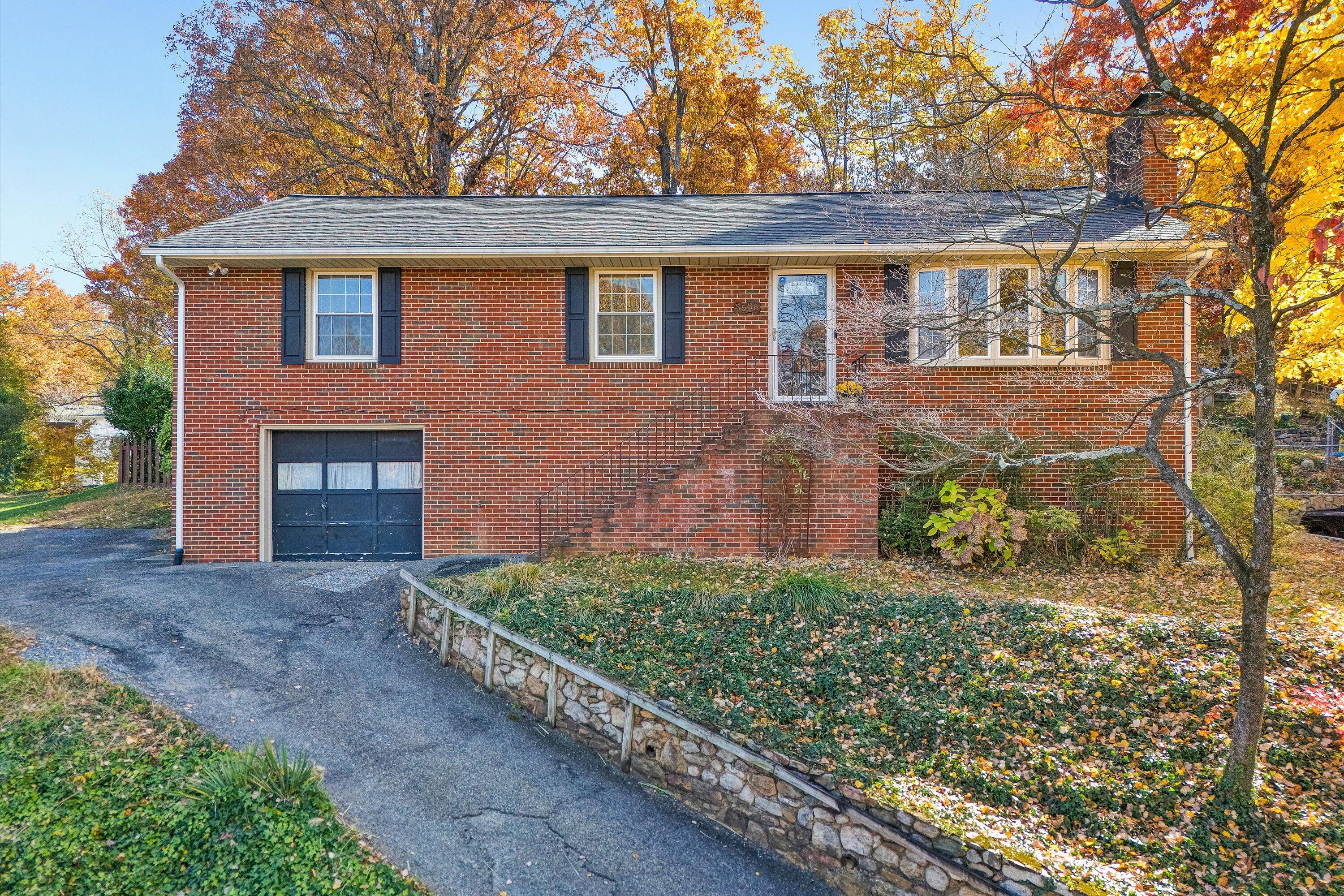 3536 Forester Road Southwest Roanoke, VA 24018 - Photo 1 of 26 a front view of a house with a yard