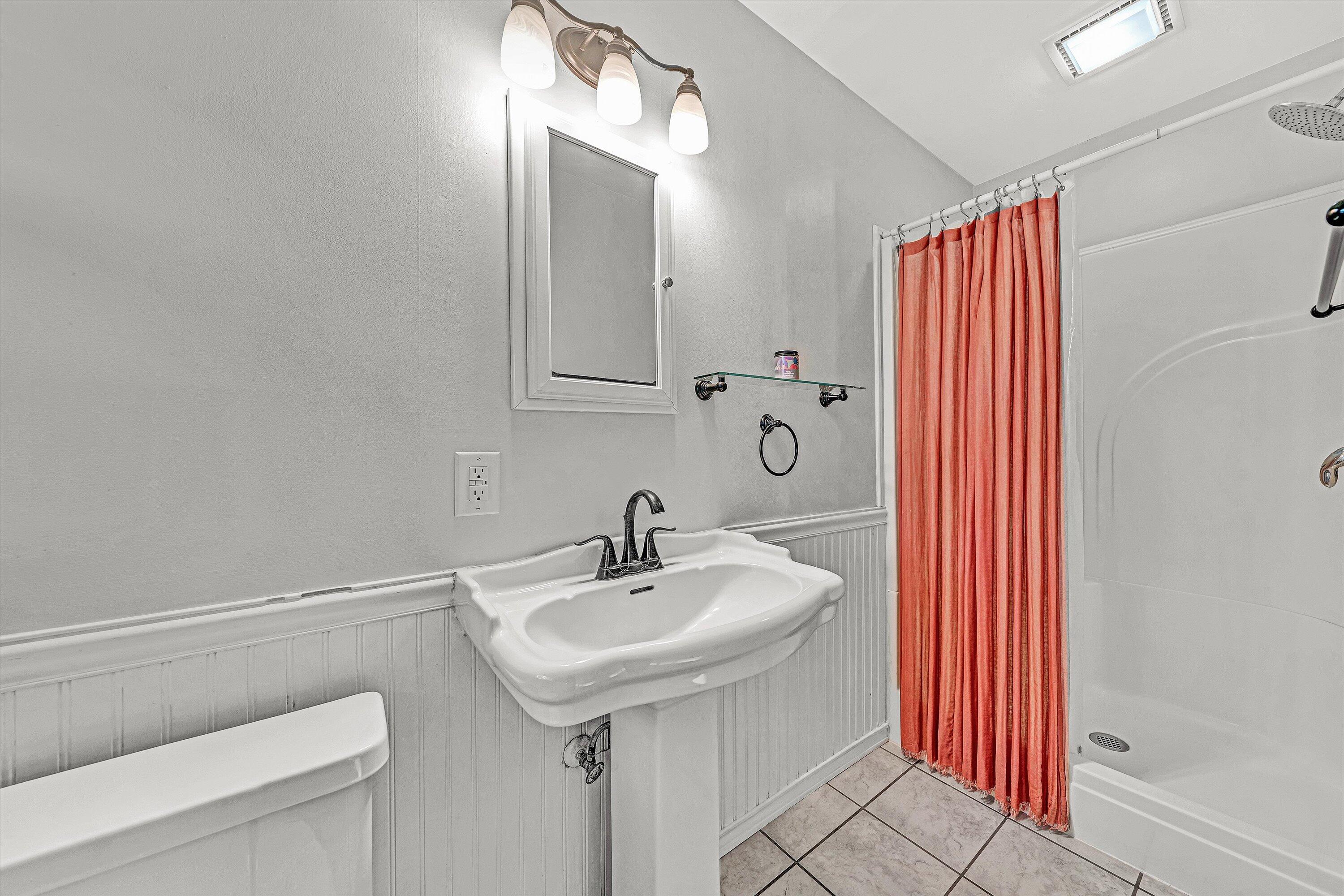 3536 Forester Road Southwest Roanoke, VA 24018 - Photo 15 of 26 a bathroom with a sink a toilet and shower