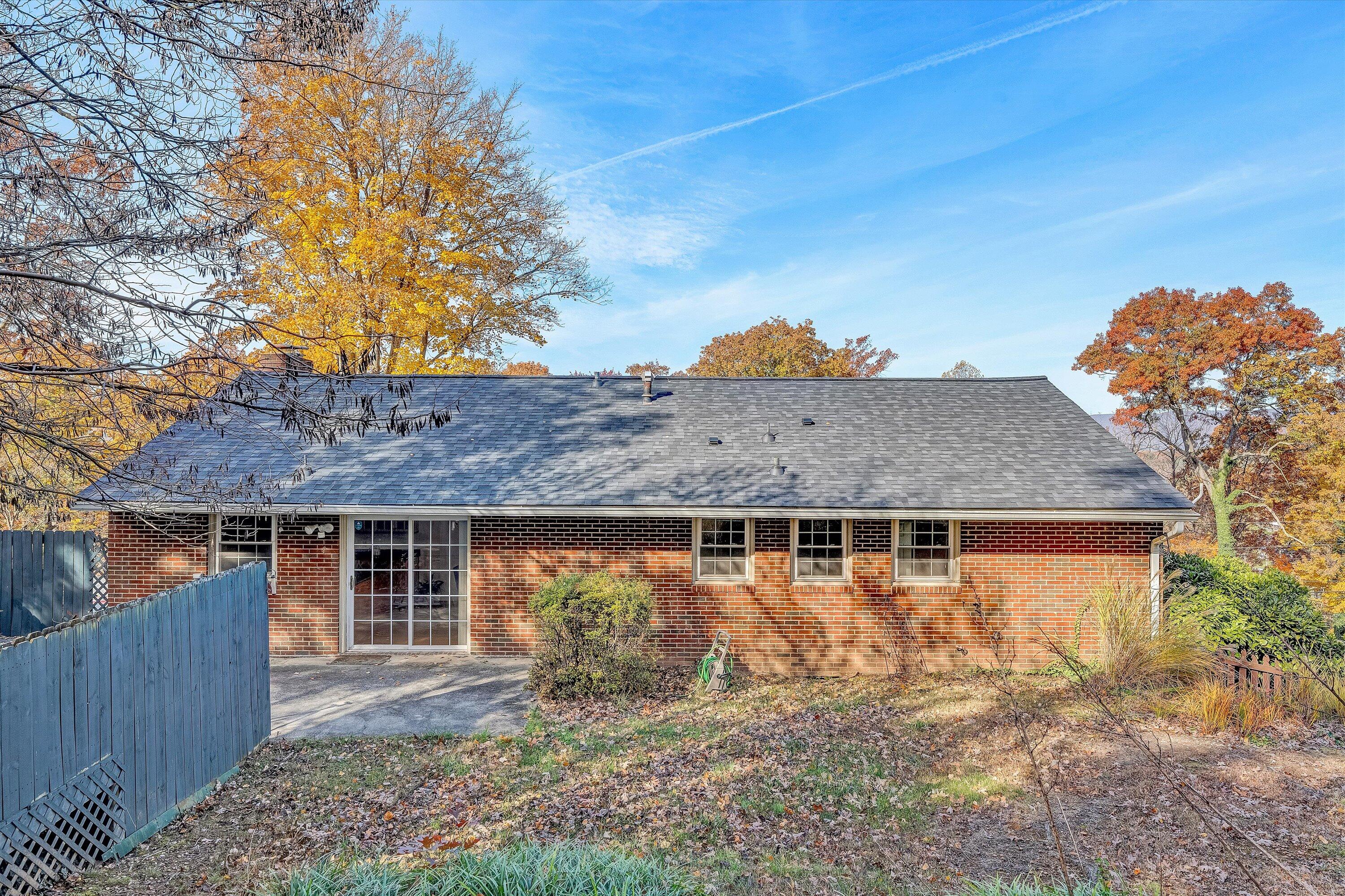 3536 Forester Road Southwest Roanoke, VA 24018 - Photo 23 of 26 a front view of a house with a garden