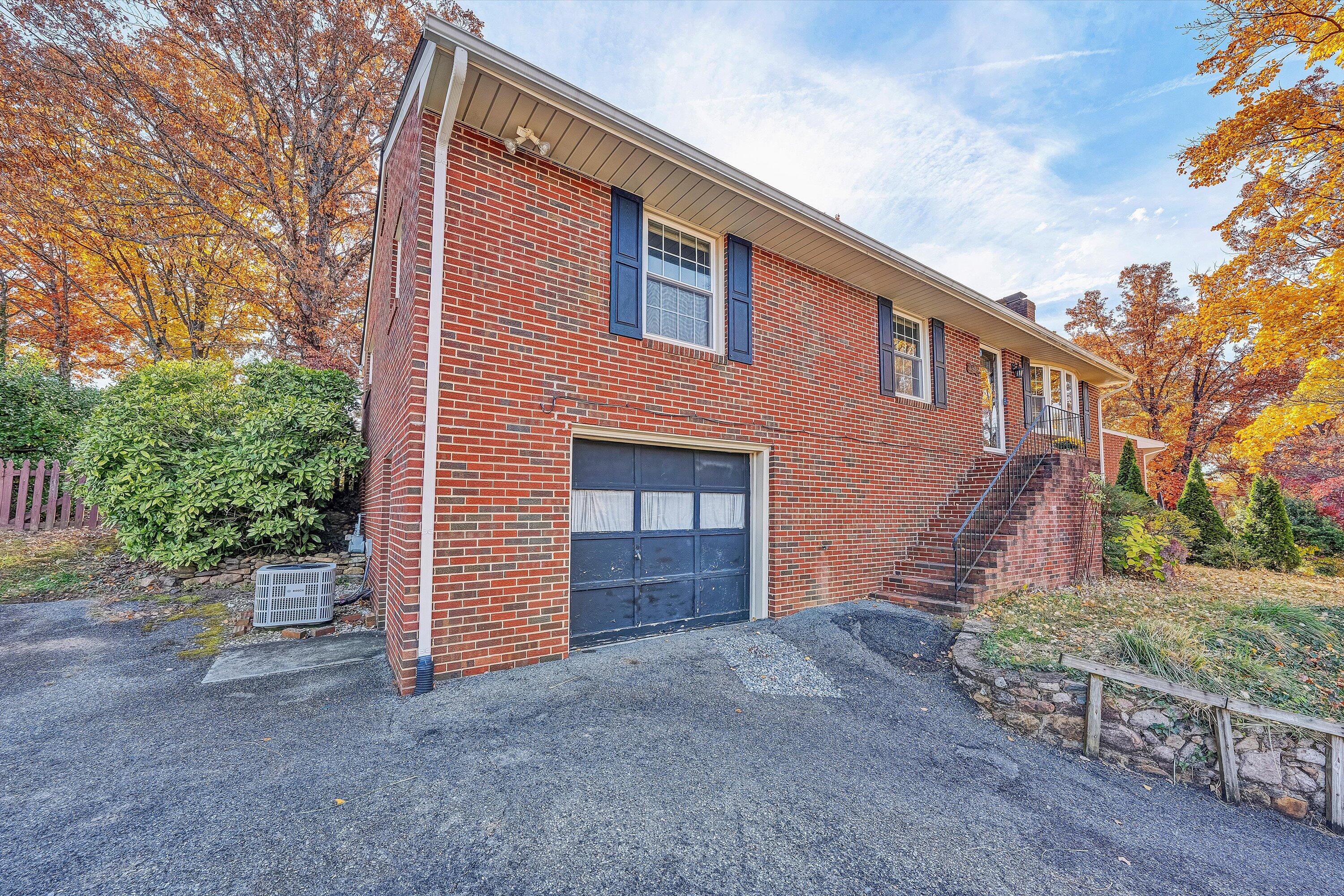 3536 Forester Road Southwest Roanoke, VA 24018 - Photo 26 of 26 a front view of a house with a yard and garage