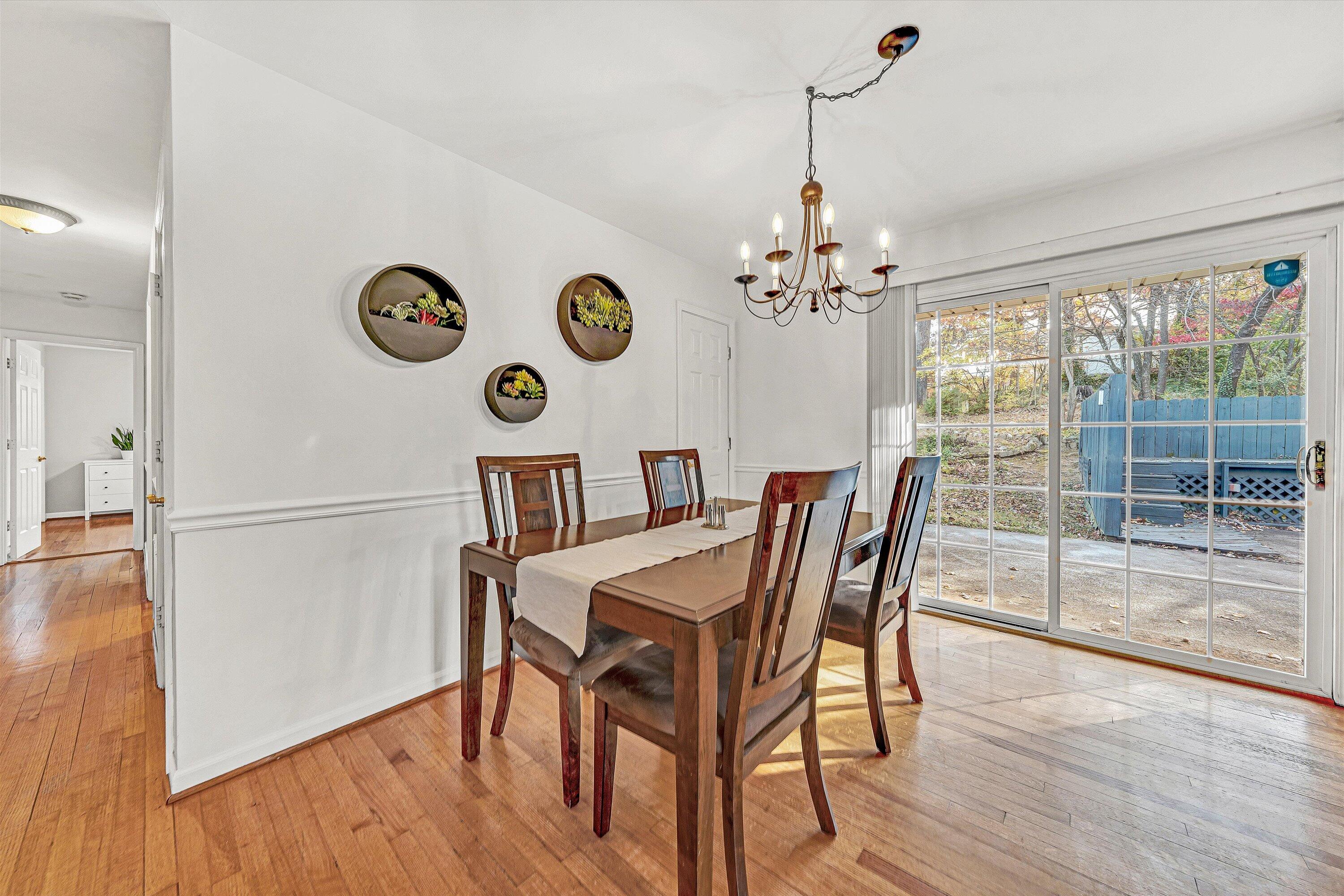3536 Forester Road Southwest Roanoke, VA 24018 - Photo 5 of 26 a view of a dining room with furniture wooden floor and a chandelier