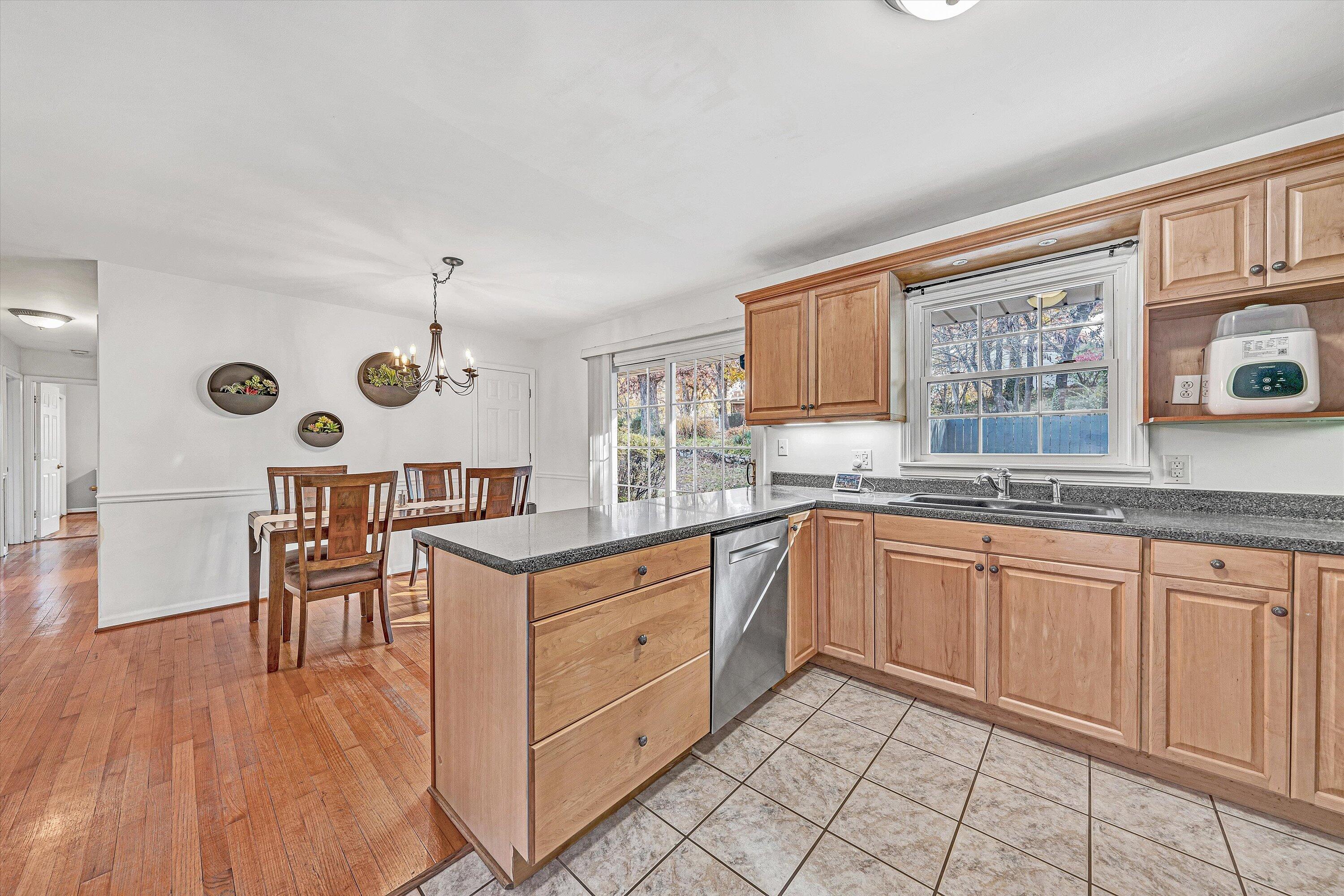 3536 Forester Road Southwest Roanoke, VA 24018 - Photo 7 of 26 a kitchen with stainless steel appliances granite countertop a stove and cabinets