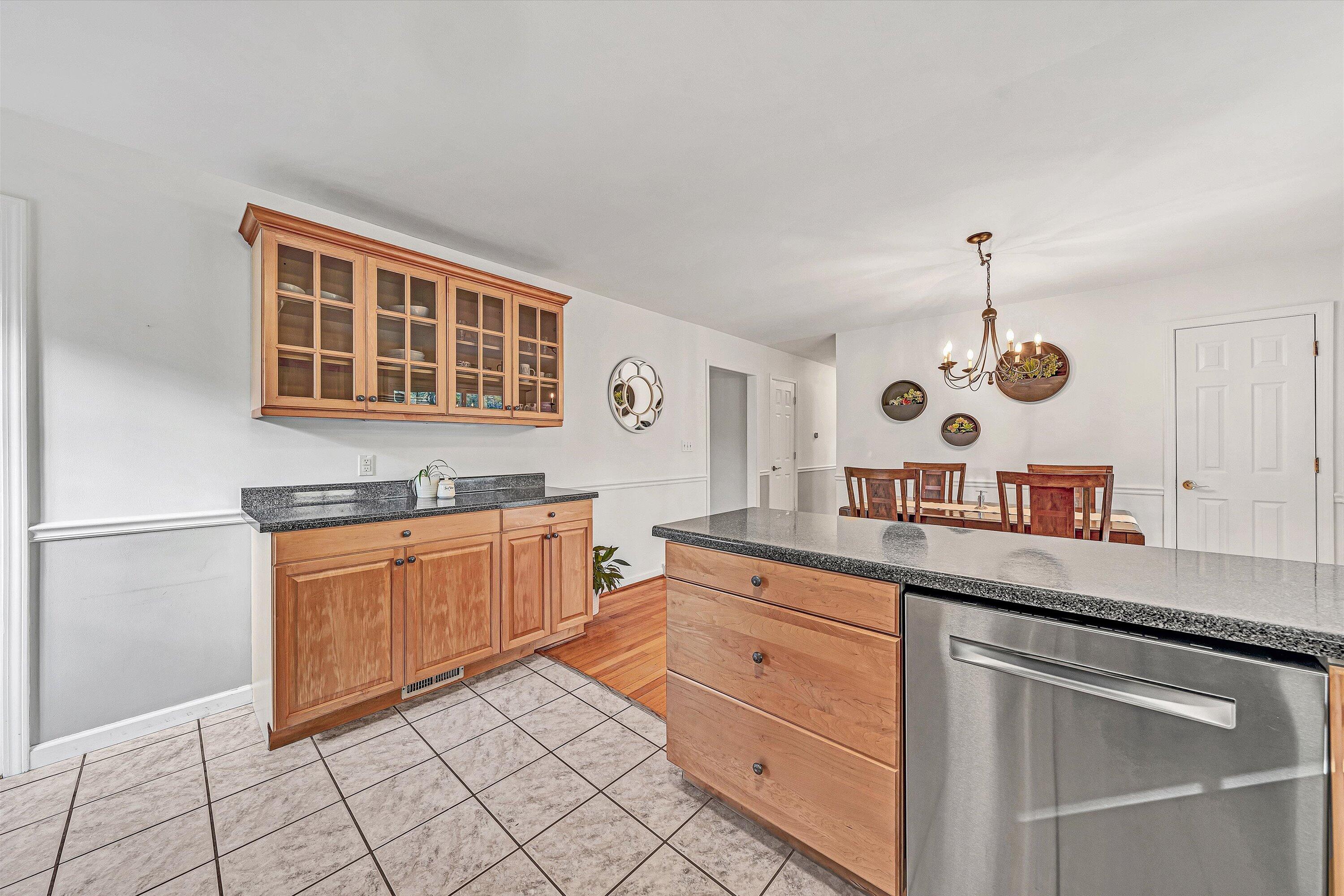 3536 Forester Road Southwest Roanoke, VA 24018 - Photo 8 of 26 a kitchen with granite countertop cabinets and window