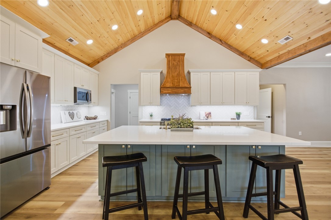 147 McAlister Road West Union, SC 29696 - Photo 7 of 49 This airy kitchen features a vaulted ceiling and ample counter space, perfect for culinary adventures.
