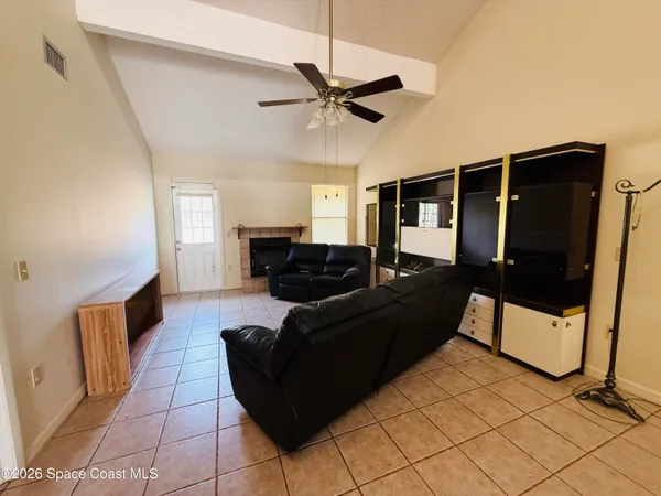 a kitchen with stainless steel appliances granite countertop a refrigerator and a stove