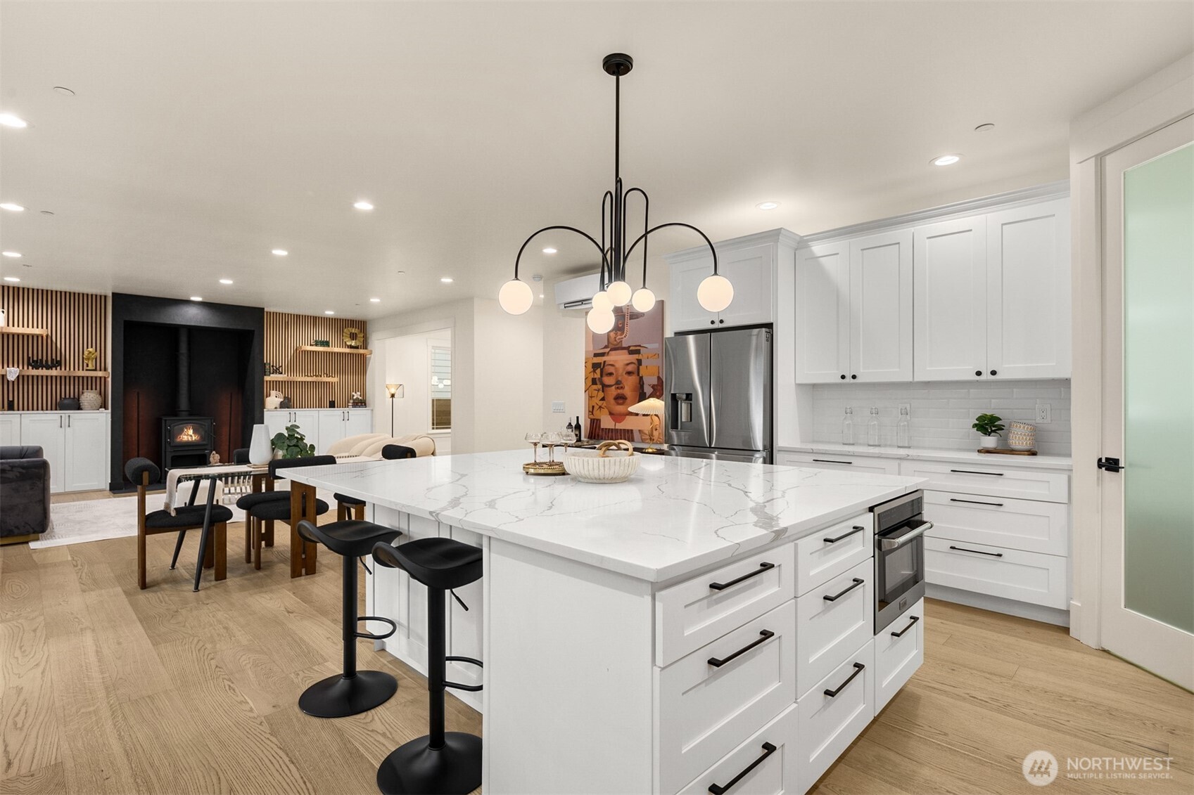 2411 Southwest 346th Street Federal Way, WA 98023 - Photo 11 of 39 a kitchen with kitchen island granite countertop a sink cabinets and wooden floor