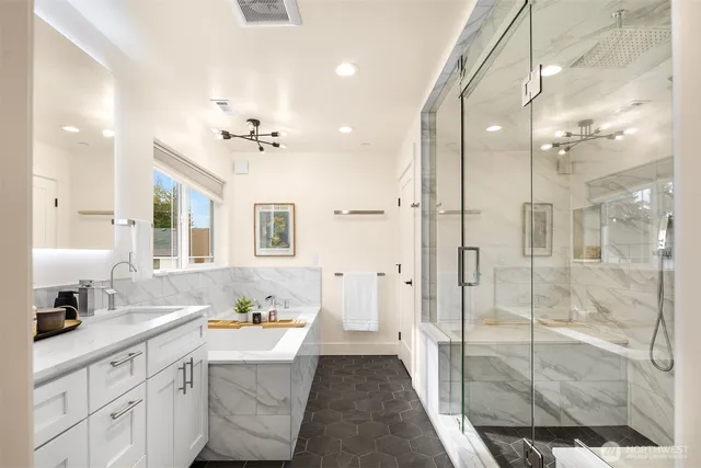a bathroom with a double vanity sink mirror and shower