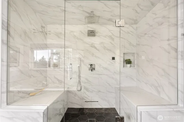 a bathroom with a bathtub and shower