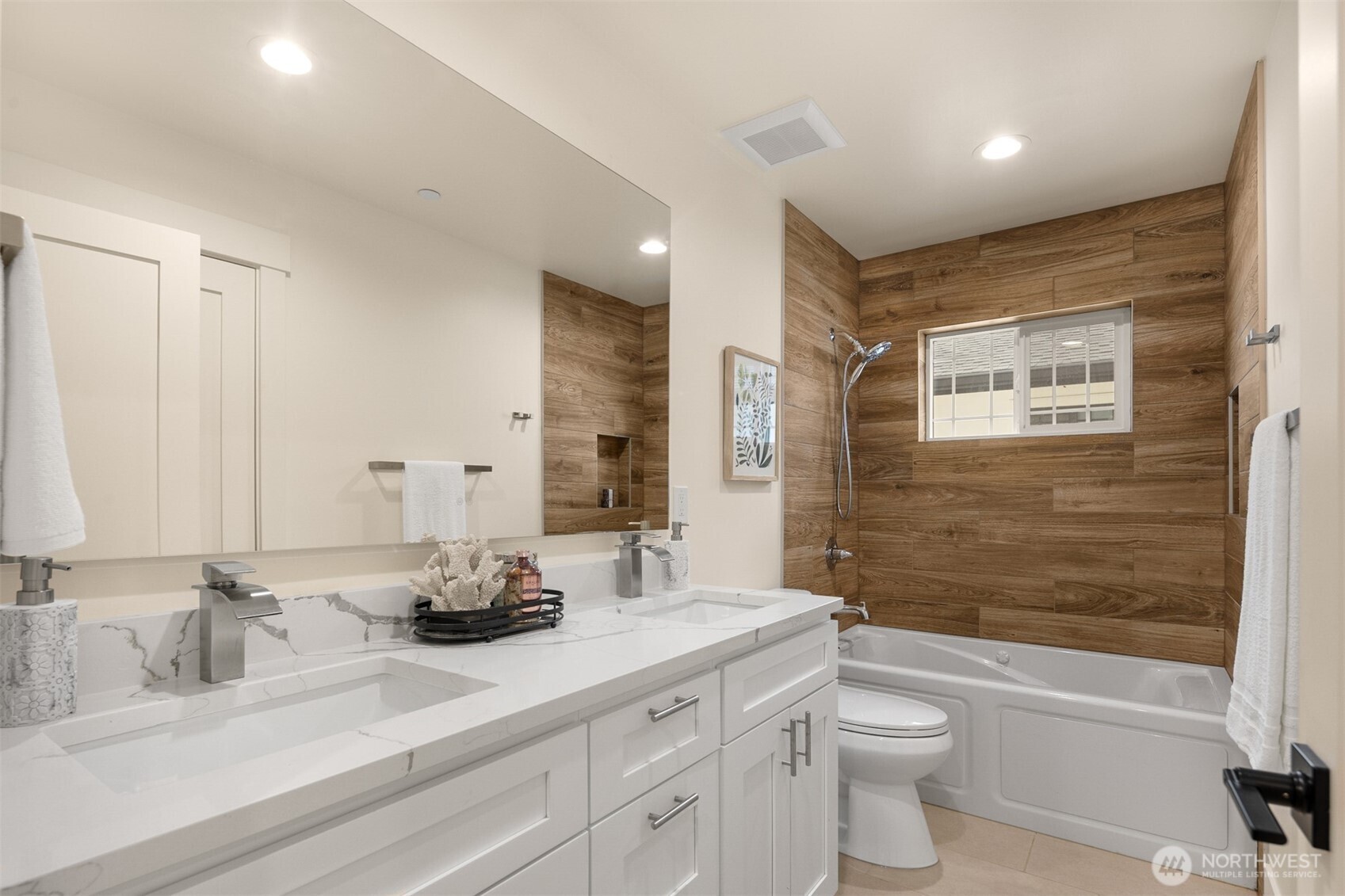 2411 Southwest 346th Street Federal Way, WA 98023 - Photo 20 of 39 a bathroom with a double vanity sink toilet mirror and bathtub
