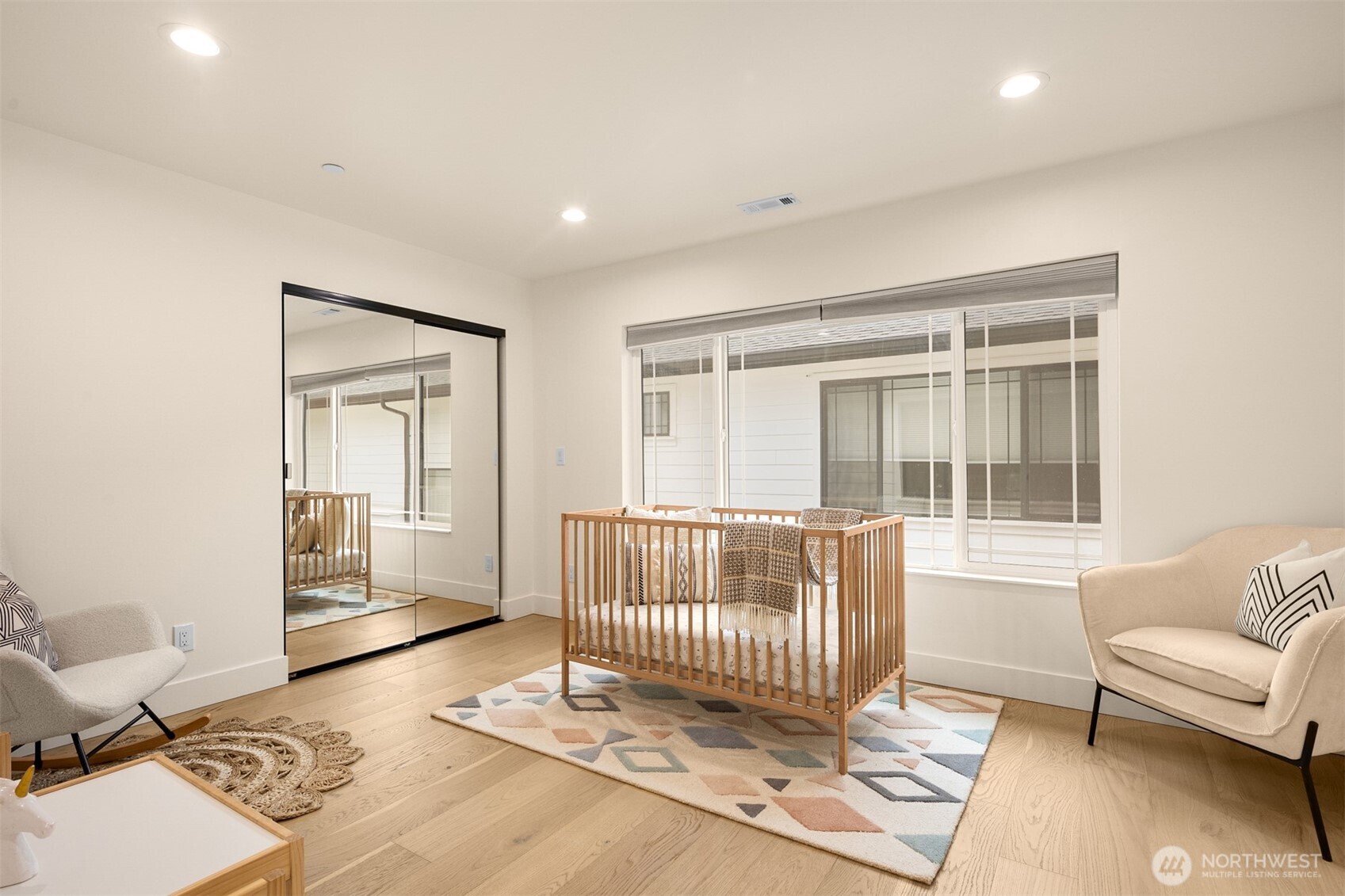 2411 Southwest 346th Street Federal Way, WA 98023 - Photo 22 of 39 a living room with a couch and a table with wooden floor