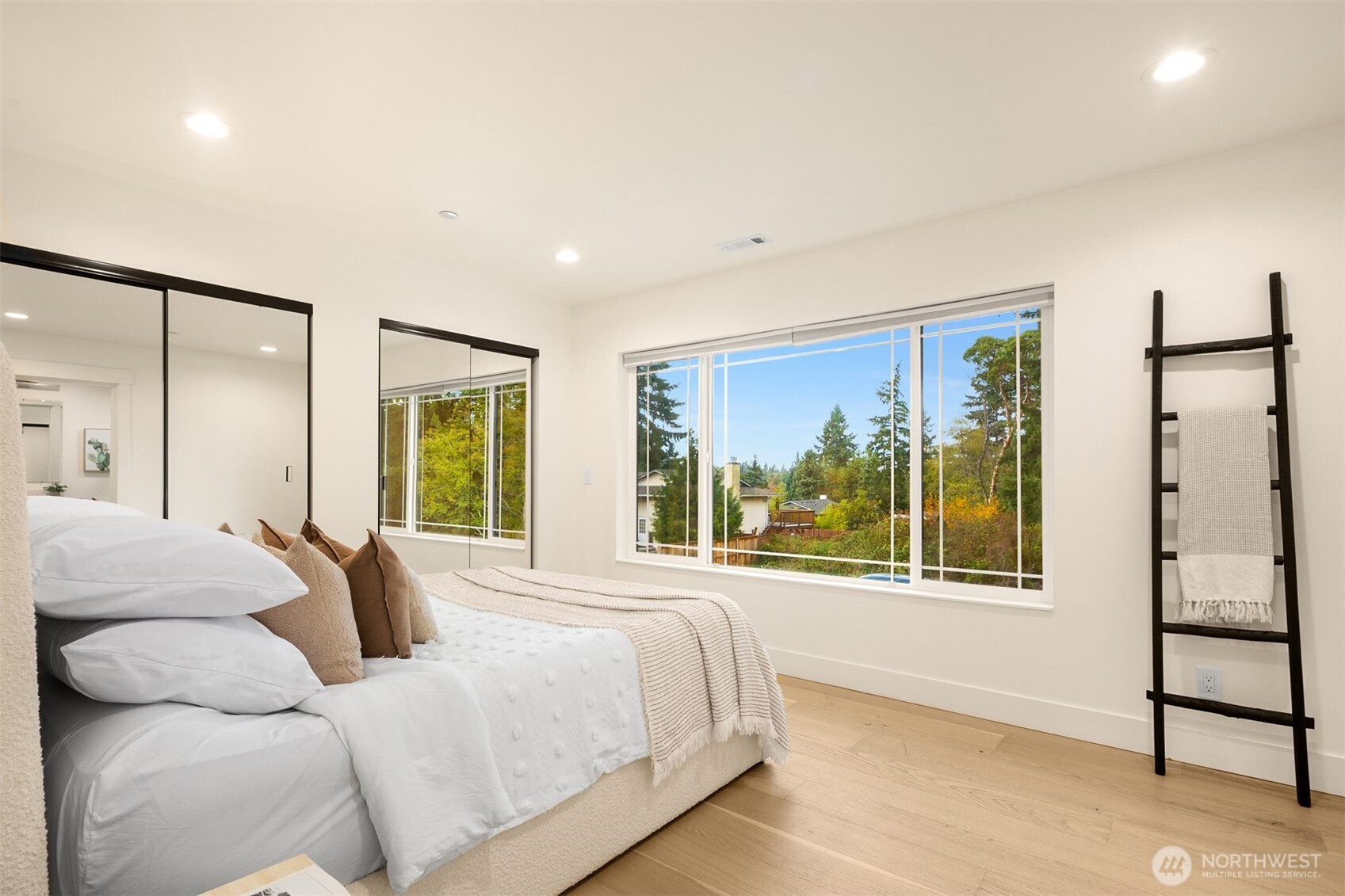 2411 Southwest 346th Street Federal Way, WA 98023 - Photo 23 of 39 a bedroom with a large bed and a large window