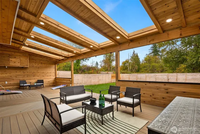 a balcony with furniture and a rug